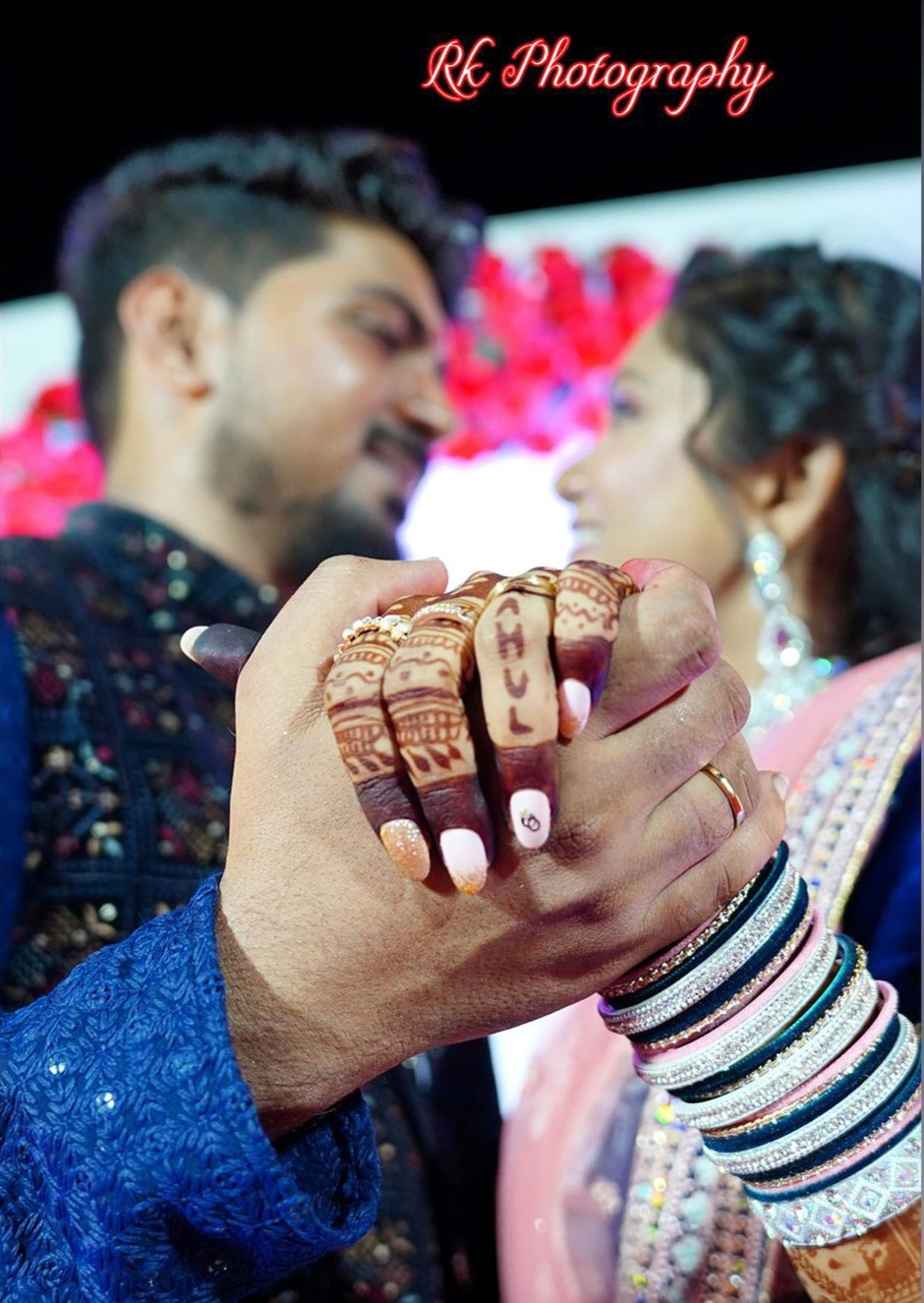 Couple holding hands at their celebration